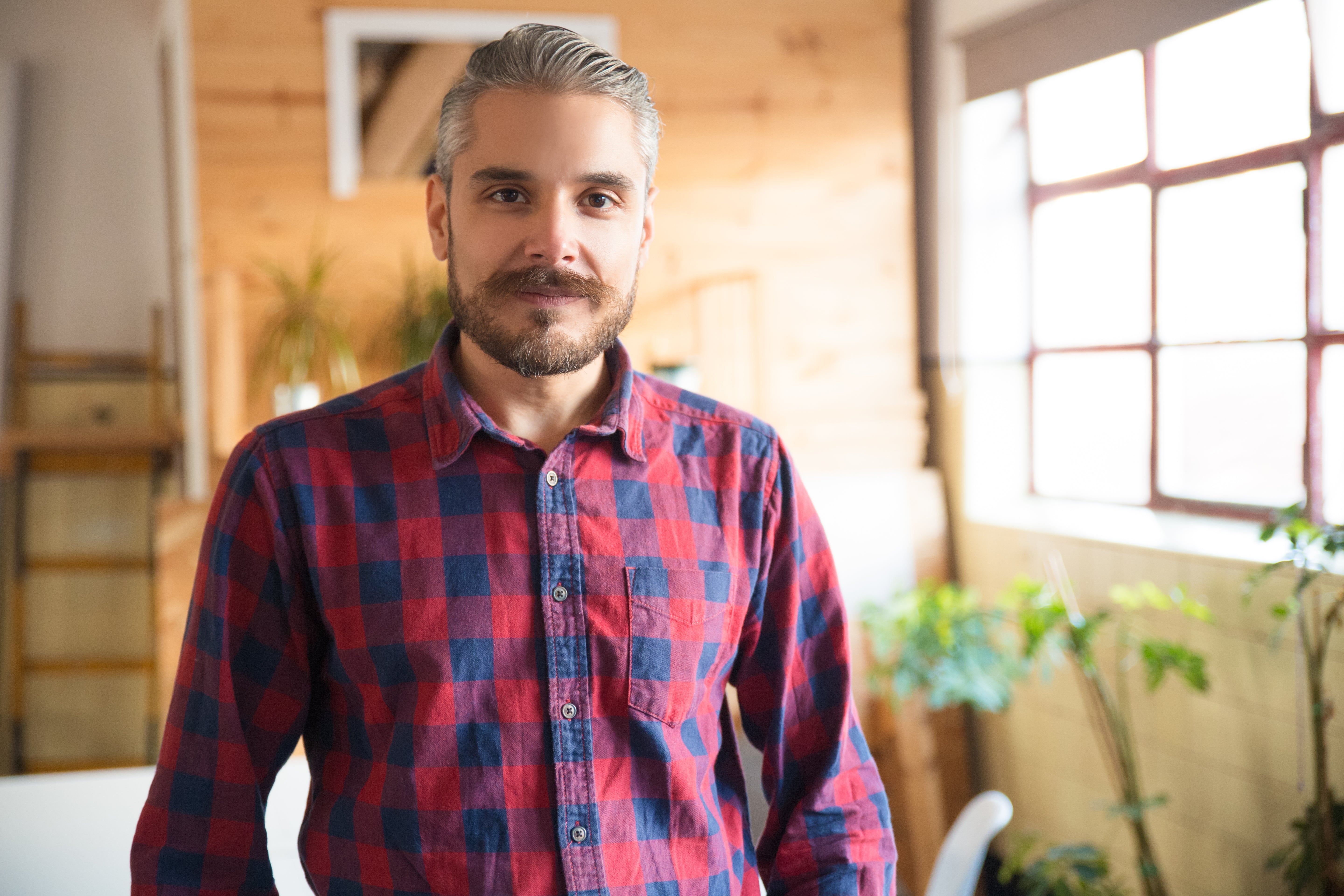 files/friendly-entrepreneur-posing-modern-office.jpg